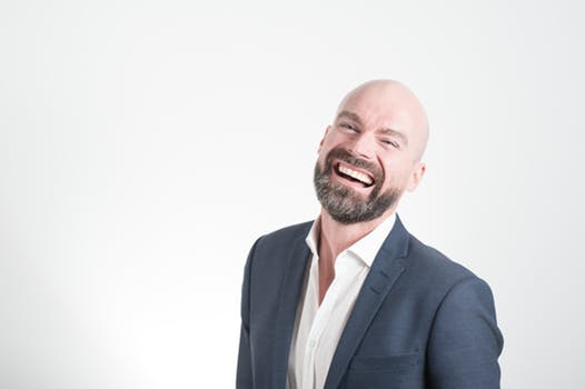 Business Man Smiling Using G Suite for business