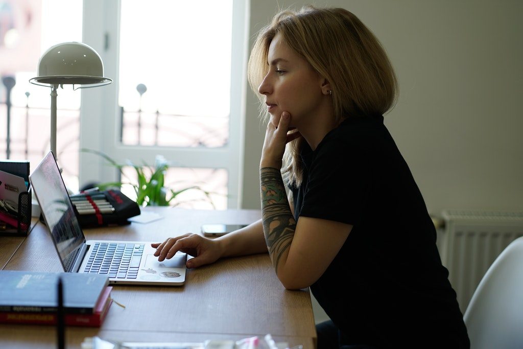 Woman in Black T-shirt Using Laptop Computer