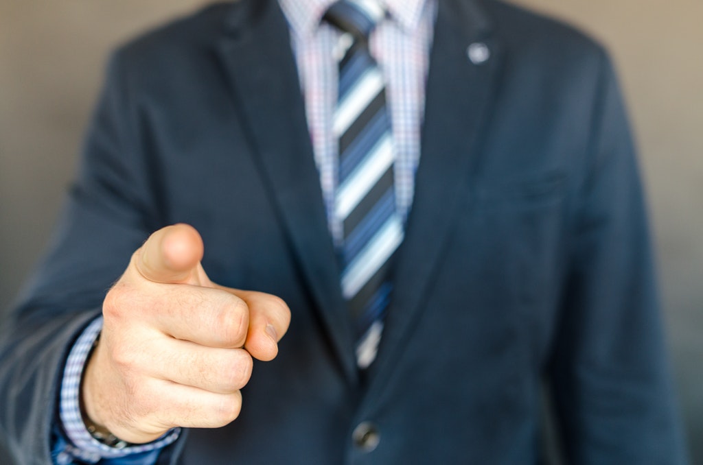 Businessman/Entrepreneur pointing finger at the mistakes.