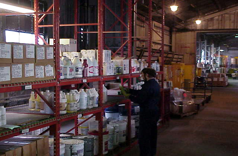 A worker takes inventory at the Hazardous Material Control Center. The HMCC, located on Michael Street, reissues serviceable hazardous materials back to various units instead of being disposed of as hazardous waste. (photo courtesy of the Hazardous Material Control Center)