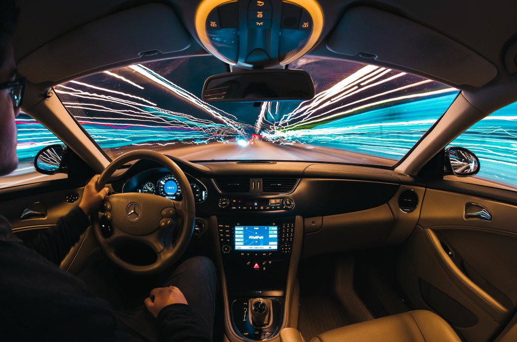Time lapse photography of man riding car photo – Future Car Technology.