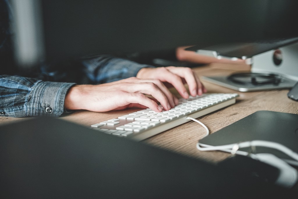 Person using computer keyboard photo