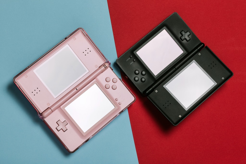 Pink and Black Nintendo DS Portable Gaming Consoles