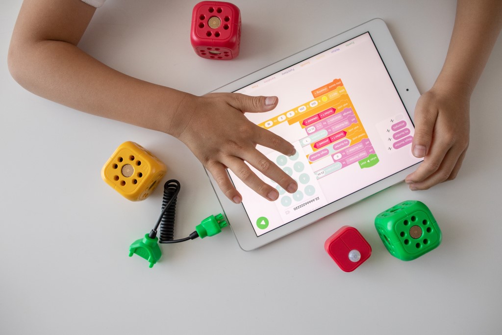 Kid Using a Tablet for Visual Programming