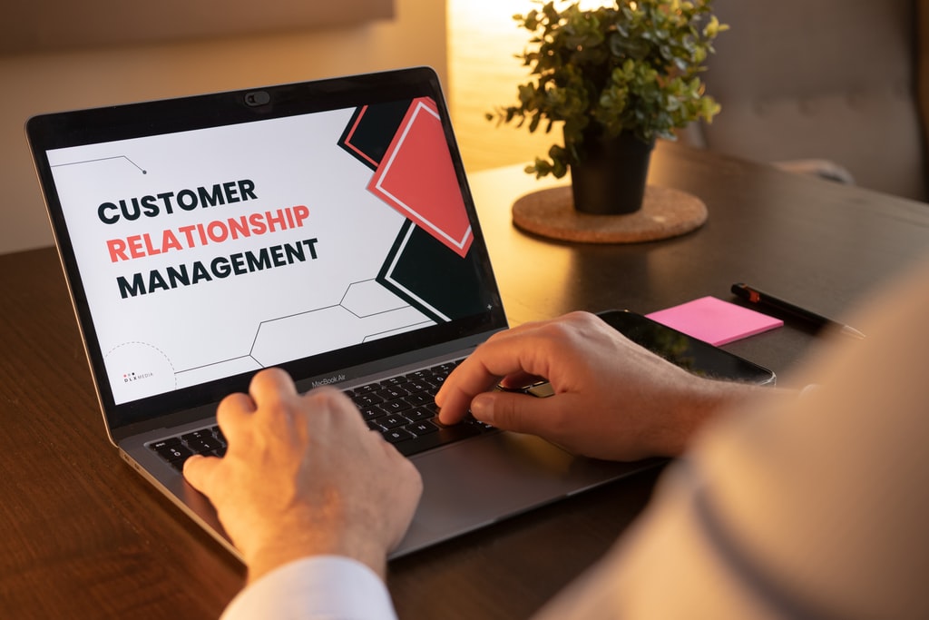 Customer Relationship Management (CRM software) running on a laptop