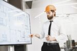 Construction Architect Engineer Explaining Blueprints