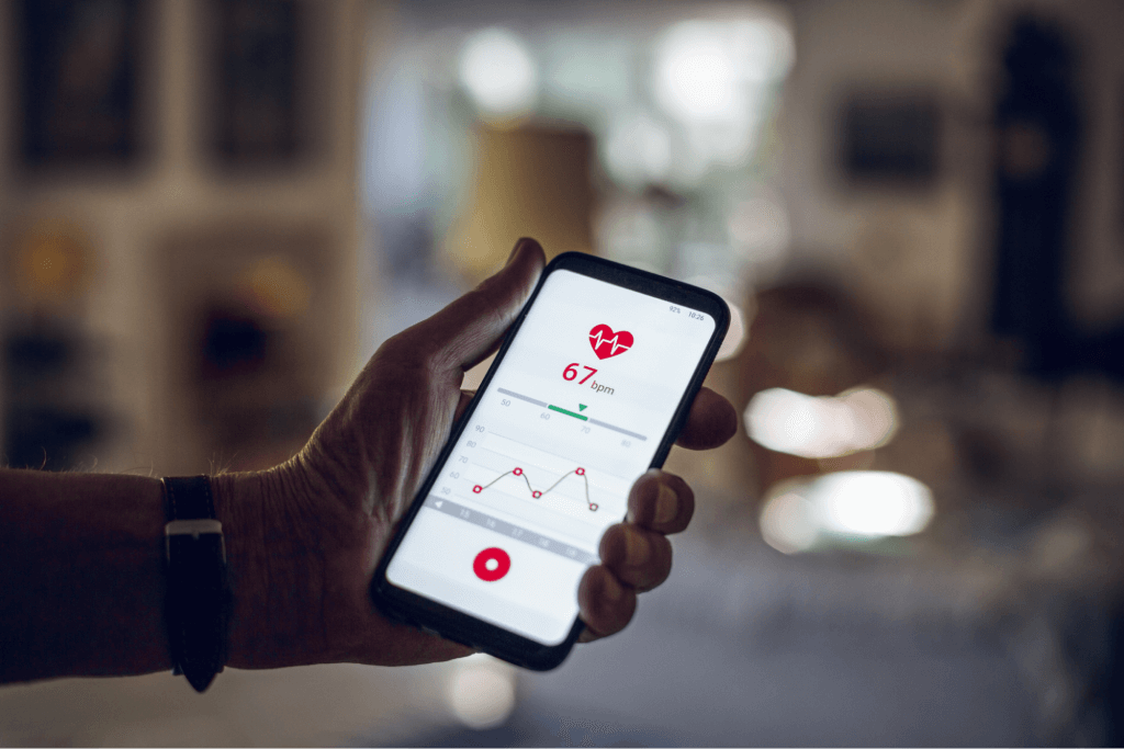 Senior Holding Smartphone, Using Wellness App