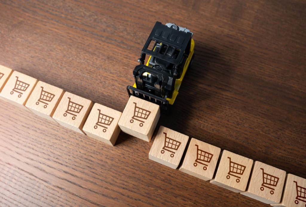 Forklift prepares delivery of orders. Online shopping. Adding items to cart. Logistics and transportation. Warehousing.