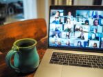 MacBook Pro displaying group of people on a Zoom call