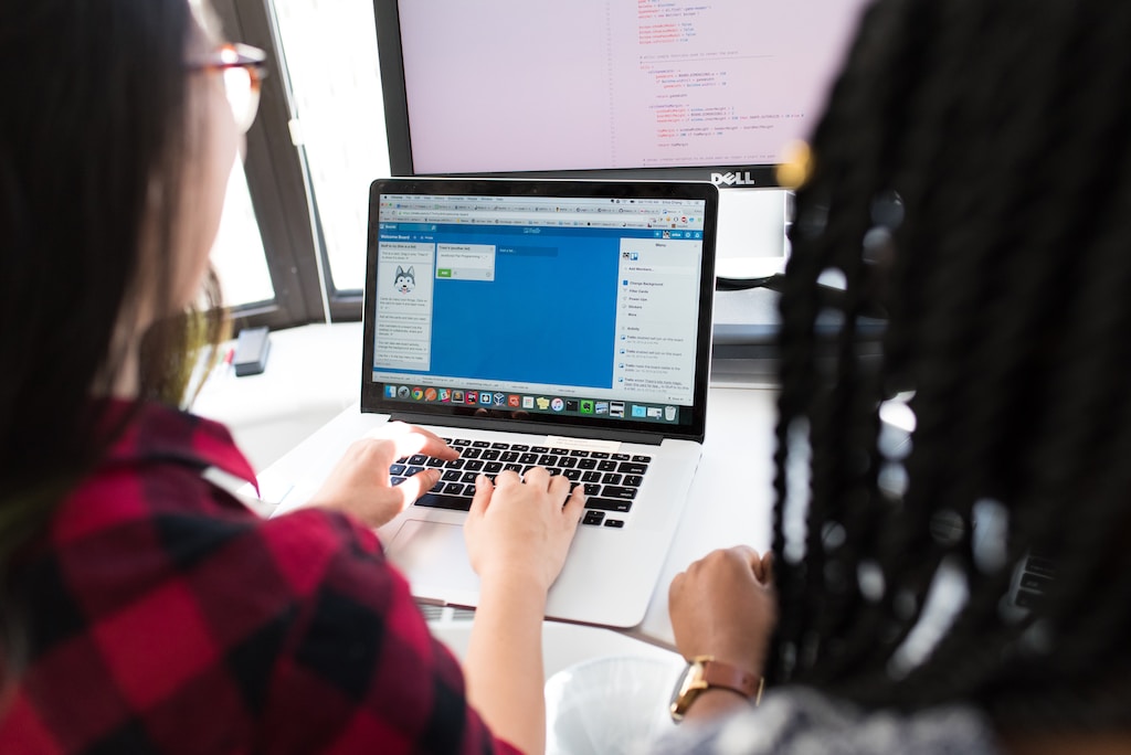 Women in tech using MacBook Pro