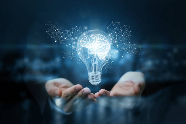 Light bulb with brain inside the hands of the businessman. The concept of the business idea.