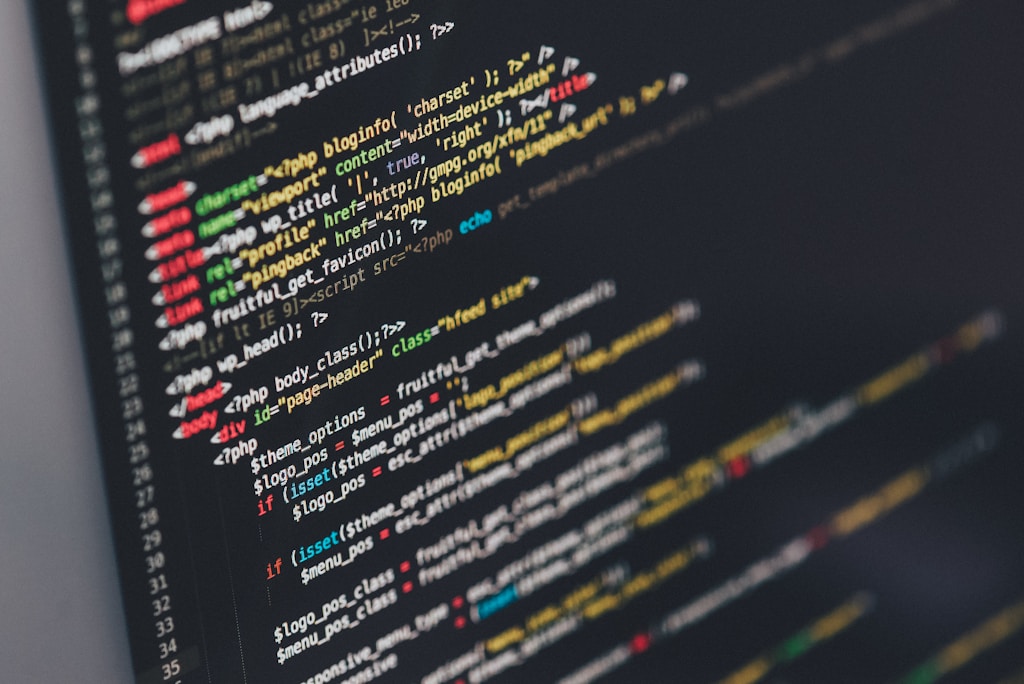 Software escrow shields your source code from risk. WordPress responsive theme source code displayed on this photo.