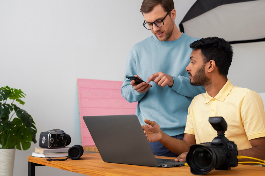 Collaboration photo. Specialized photographers working in studio.